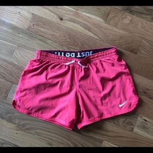 Hot pink nike shorts with built in spandex